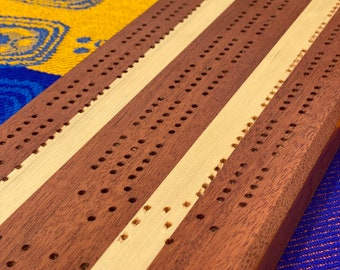 Hand made , solid wood, Sapele, white pine cribbage board.