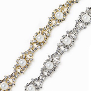 May include: Two strands of rhinestone trim with faux pearl accents. One strand is gold and the other is silver.