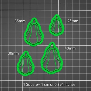 May include: Four green plastic cookie cutters shaped like gourds, with different sizes. The largest cutter is 40 mm, the next largest is 35 mm, the next is 30 mm, and the smallest is 25 mm. 1 Square = 1 cm or 0.394 inches.