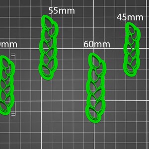 May include: Four green plastic leaf-shaped cookie cutters, sized at 50mm, 55mm, 60mm, and 45mm. The cutters are displayed on a grey grid background, with measurements in millimetres.
