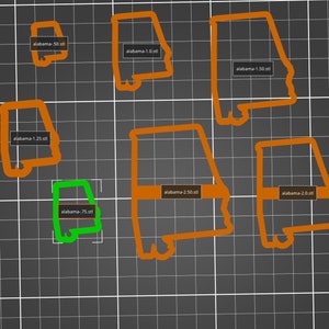 Può includere: Sette contorni arancioni dello stato dell'Alabama di diverse dimensioni, con i nomi dei file "alabama-50.stl", "alabama-1.0.stl", "alabama-1.50.stl", "alabama-1.25.stl", "alabama-2.50.stl", "alabama-2.0.stl" e "alabama-75.stl" scritti su ogni contorno.