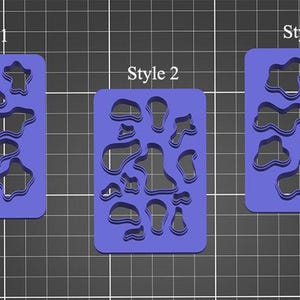 May include: Three blue plastic stencils with different patterns of irregular shapes. The stencils are labeled "Style 1", "Style 2", and "Style 3".