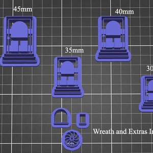 May include: Set of six blue plastic cookie cutters in various sizes, shaped like a traditional gingerbread house. The cutters are arranged on a gray grid background. The largest cutter is 4.5 inches wide, the smallest is 3 inches wide.  "Wreath and Extras Included" is written in black text at the bottom of the image.