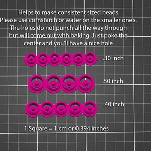 May include: Three rows of pink plastic bead moulds with different sizes. The moulds are on a grey grid background. The text on the image reads: "Helps to make consistent sized beads. Please use cornstarch or water on the smaller ones. The holes do not punch all the way through but will come out with baking. Just poke the centre and you'll have a nice hole. .30 inch .50 inch .40 inch 1 Square = 1 cm or 0.394 inches"