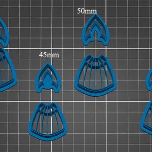 May include: Set of five blue plastic cookie cutters in different sizes. The cutters are shaped like a skirt with a pointed top. The cutters measure 40mm, 45mm, 50mm, and 55mm.