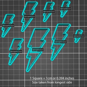 May include: A set of nine turquoise lightning bolt cookie cutters in various sizes, ranging from 1.0 to 3.0 inches. The cookie cutters are displayed on a black grid background with the text "1 Square = 1cm or 0.394 inches" and "Size taken from longest side".
