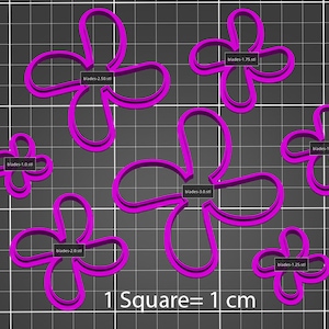 May include: A set of eight pink plastic cookie cutters shaped like flowers with different sizes. The cutters are arranged on a gray grid background. The text "1 Square = 1 cm" is printed below the cutters.