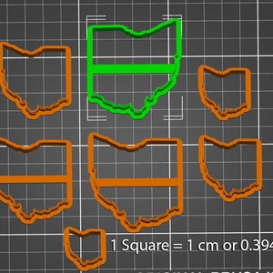 May include: Set of six cookie cutters in the shape of the state of Ohio. The cutters are made of orange plastic and are arranged on a gray grid background. The largest cutter is 3.94 inches wide.  1 Square = 1 cm or 0.394 inch.