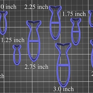 May include: A set of nine blue plastic cookie cutters shaped like fish. The cutters range in size from 1.00 to 3.00 inches.