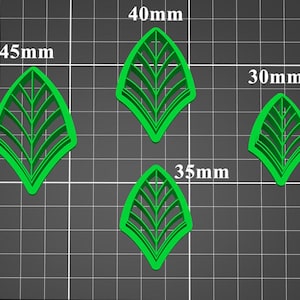 May include: Four green leaf-shaped cutters in various sizes. The largest measures 45mm, the next is 40mm, followed by 35mm, and the smallest is 30mm. The cutters have a detailed vein design, perfect for crafting.