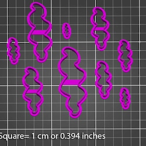 Könnte beinhalten: Eine Sammlung von lila Kunststoff-Ausstechern in verschiedenen Größen und Formen, darunter ein langes, wellenförmiges Design und kleinere, ovale Formen. Das Bild enthält den Text: "1 Quadrat = 1 cm oder 0,394 Zoll."