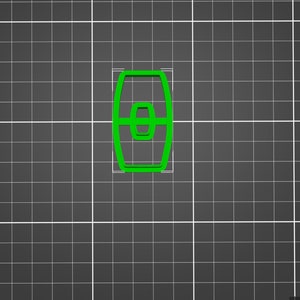 May include: A green plastic cookie cutter shaped like a barrel. The cookie cutter is on a gray grid background.