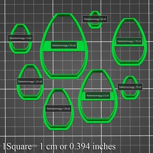 Może przedstawiać: Zestaw 8 zielonych plastikowych foremek do ciasteczek w kształcie jajek z płaskim dnem. Formy są oznaczone rozmiarem w centymetrach: 1,27, 1,91, 2,54, 3,18, 3,81, 4,45, 5,08 i 6,35. Obraz zawiera tekst "1 Kwadrat = 1 cm lub 0,394 cala".