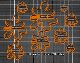 May include: Eight different sizes of orange plastic cookie cutters shaped like a flower with 7 points. The cutters are arranged on a black and white grid with the text "1 Square = 1 cm or 0.394 inches".