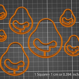 Puede incluir: Conjunto de seis cortadores de galletas en forma de aguacate naranja. Los cortadores están dispuestos sobre un fondo de cuadrícula gris. 1 Cuadrado = 1 cm o 0,394 pulgadas.