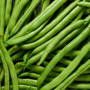 May include: A close-up image of a bunch of fresh green string beans. The beans are arranged in a random pattern, showing their long, slender shape and vibrant green colour.