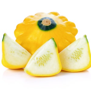 May include: A whole yellow patty pan squash with three slices of the squash. The slices are arranged in a semi-circle around the whole squash.
