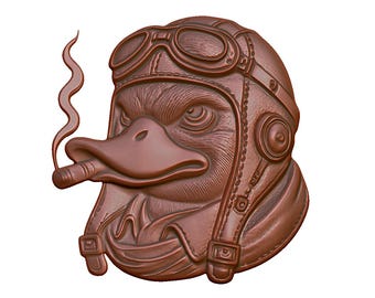 May include: A brown ceramic sculpture of a duck wearing a leather aviator helmet and goggles, holding a cigarette in its beak. The duck has a serious expression on its face.