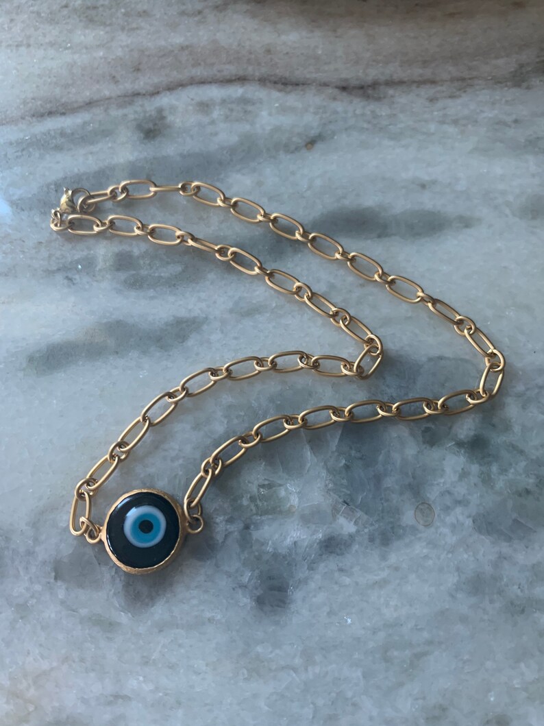 Large Blue Evil Eye matte gold filled necklace.