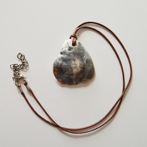 Sea pottery and beach finds pendant, 30 cm