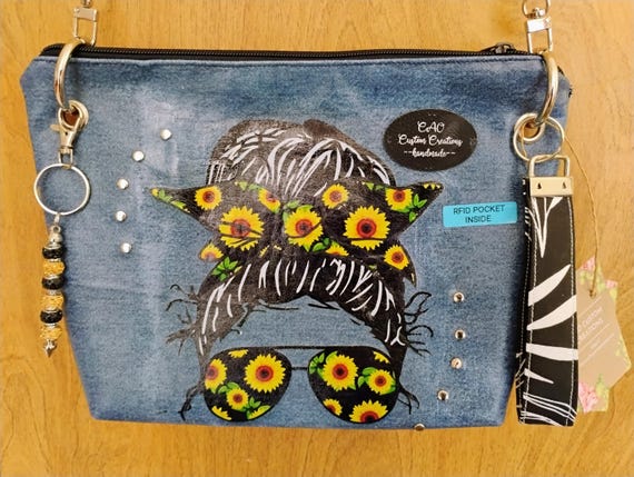 A girl wearing sunflower glasses crafted from recycled jeans.
