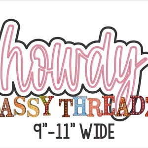 May include: A pink neon sign that says "howdy" with a colorful, multi-colored, light-up sign that says "SASSY THREADZ" below it. The sign is 9-11 inches wide.