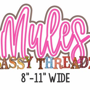 May include: Pink neon sign with the word "Mules" in a cursive font. Below the sign is the text "SASSY THREADZ" in colorful block letters with light bulbs. The text "8" - 11" WIDE" is below the colorful letters.