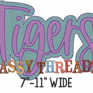 May include: A graphic design featuring the word "Tigers" in purple script with a teal outline. Below, the text "SASSY THREADZ" is in colorful, marquee-style letters. The design is 7-11 inches wide.