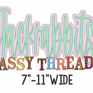 May include: A pink and green cursive word "Jackrabbits" with a colorful, multi-colored, light-up sign that reads "SASSY THREADZ" below it. The sign is 7-11 inches wide.