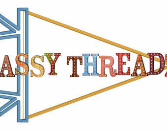 May include: A colorful pennant with the text "SASSY THREADZ" in a retro style font. The pennant is blue and gold with a white background.
