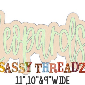 May include: A light green cursive word "Leopards" with a peach background. Below the word is a colorful sign that reads "SASSY THREADZ" with light bulbs. The sign is followed by the text "11.10 & 9" WIDE".