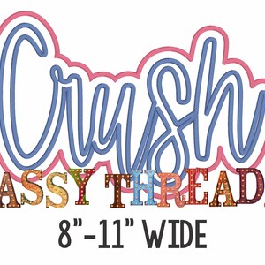May include: A blue cursive word "Crush" with a pink outline. Below the word is a colorful sign that reads "SASSY THREADZ" in a bold font. The sign is 8 to 11 inches wide.