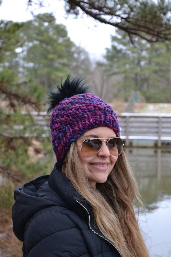 yellow hat with pom pom