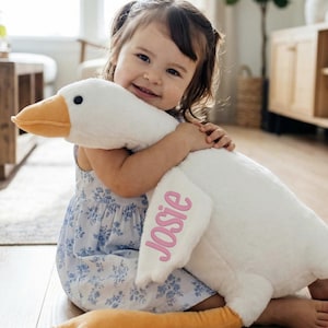 May include: A white ceramic mug with a black handle and the text "But First, Coffee" in a handwritten style. The mug is likely for hot beverages and has a glossy finish.