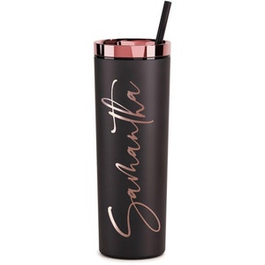 May include: Black stainless steel tumbler with a rose gold lid and straw. The tumbler has the name "Samantha" written in rose gold lettering.