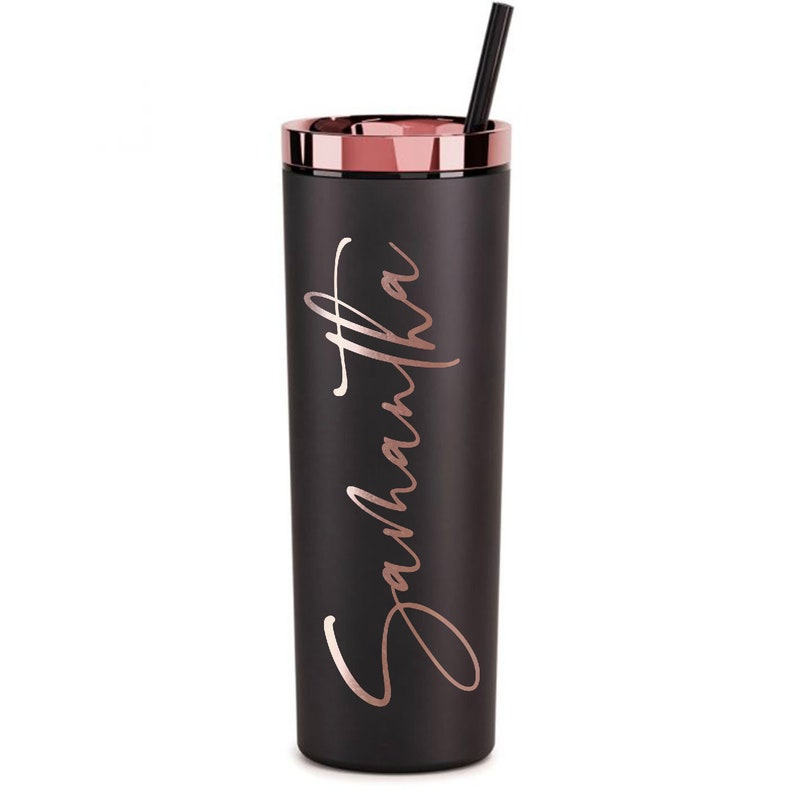 May include: Black stainless steel tumbler with a rose gold lid and straw. The tumbler has the name "Samantha" written in rose gold lettering.