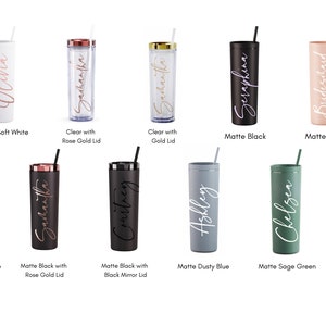 May include: Ten personalized tumblers in various colors, including white, clear, black, blush, seaglass blue, dusty blue, sage green, and teal. Each tumbler has a name or the word "Bridesmaid" written on it in white or rose gold lettering.