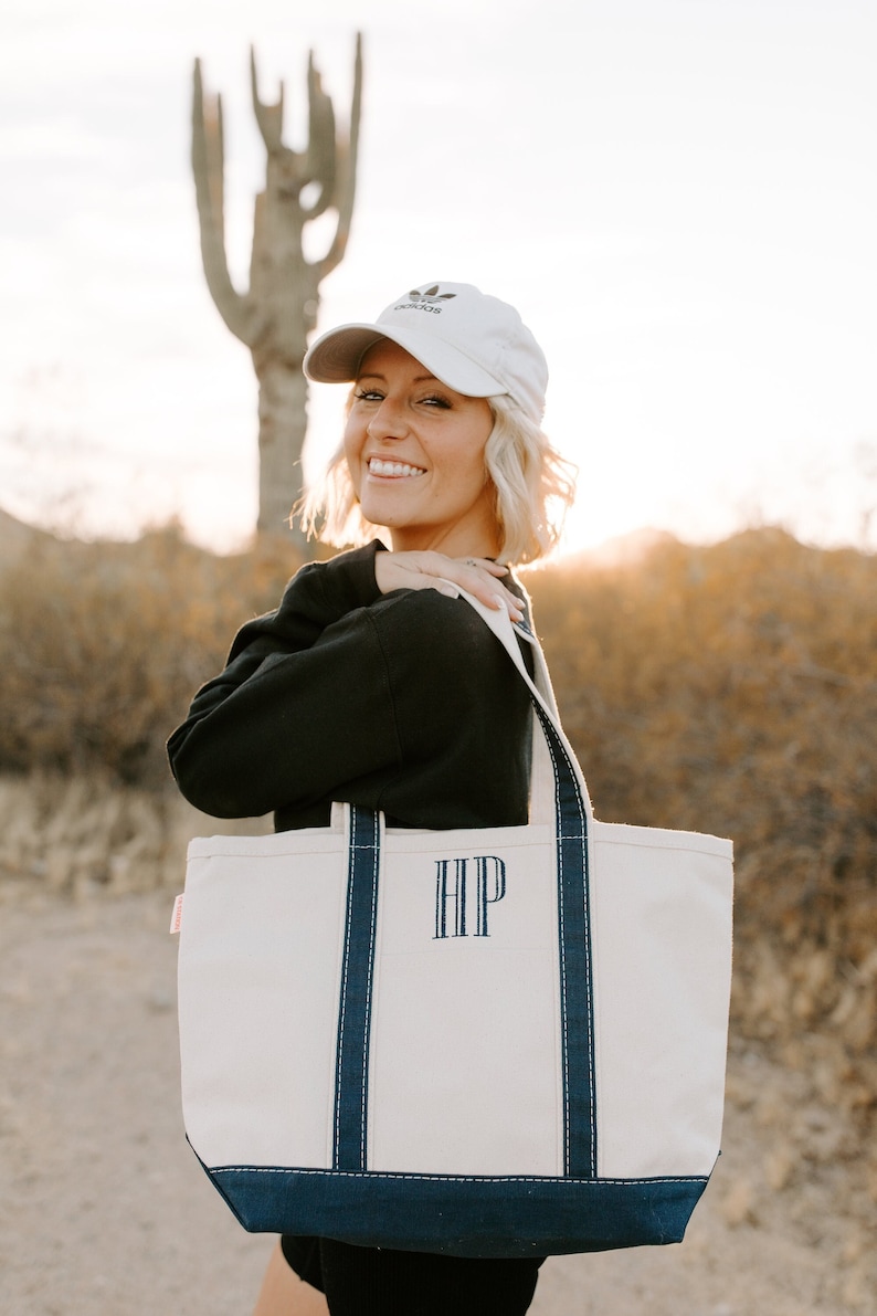A canvas tote bag with blue trim and the monogram embroidered on the front. Custom Canvas Tote Bag with Zipper, Monogram Classic Tote Bag, Bridesmaid Gift, Embroidered Tote, Bridal Party Bag, Bachelorette Party Bag