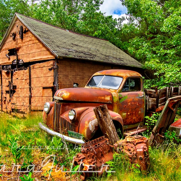 Photograph of a 1941-1947 Studebaker M Series Truck by an Abandoned Building