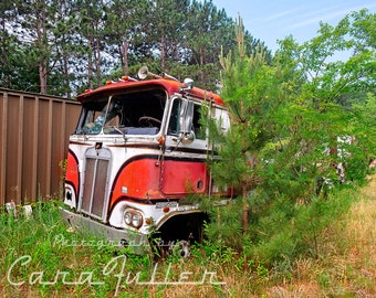 Photograph of a 1968-1983 Red Kenworth K100 Aerodyne Cab Over Diesel Tractor Trailer Semi Truck in the woods like BJ & The Bear