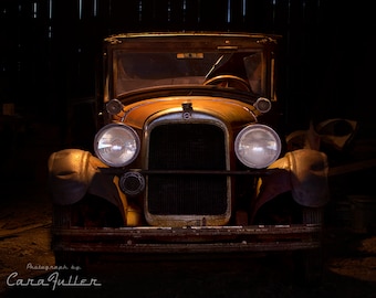 Photograph of a 1927 Studebaker in an Old Barn