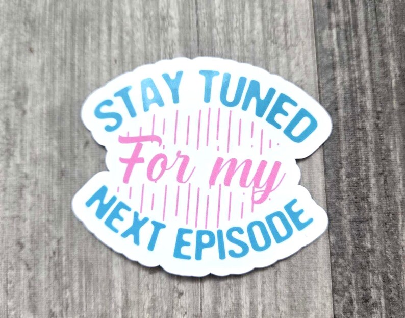 May include: A blue and white sticker with the text "Stay Tuned For My Next Episode" in a curved design. The text "For My" is in pink.