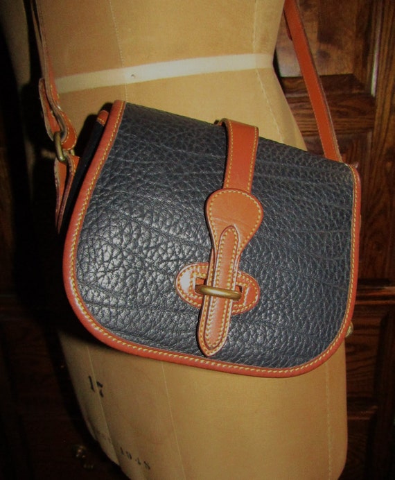 Dooney & Bourke AWL navy and tan equestrian tack crossbody bag