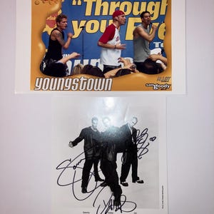 May include: Two Youngstown promotional photos. The top photo features the band members with the text "Through Your Eyes". The bottom photo is a black and white image of the band with signatures and the text "Youngstown".
