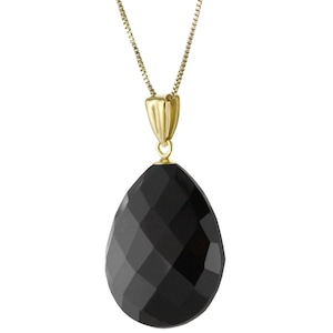 May include: A gold chain necklace with a black faceted teardrop pendant.