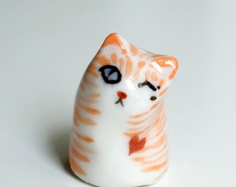 Cute orange porcelain cat, handmade porcelain winking cat! good luck kitten amulet.