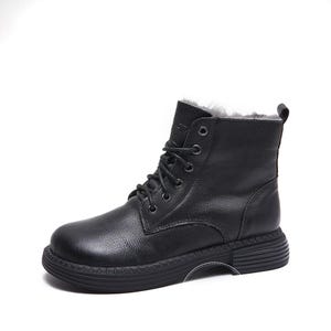 May include: Black leather ankle boots with a lace-up closure and a thick, textured sole. The boots have a warm, fuzzy lining.