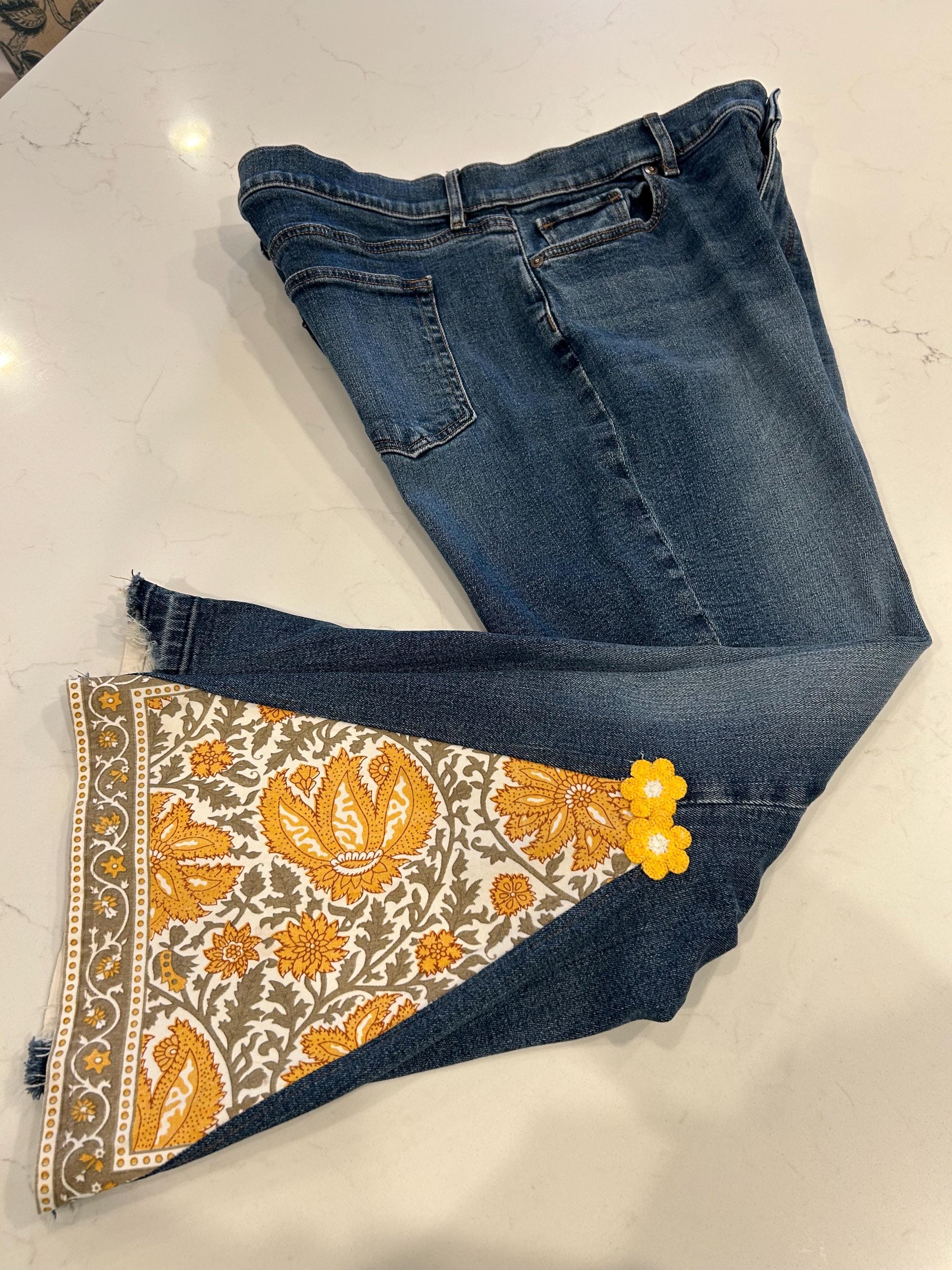 Bell bottom jeans with  Yellow custom floral pattern insert woman’s size 10