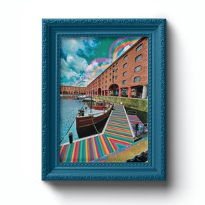May include: A framed photograph of a boat docked in a harbor with a colorful striped walkway leading to it. The building behind the boat has a red brick facade and a rainbow archway in the sky above.
