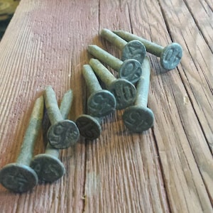 Set of 10 Antique Railroad Nails from the 30s to the 50s.